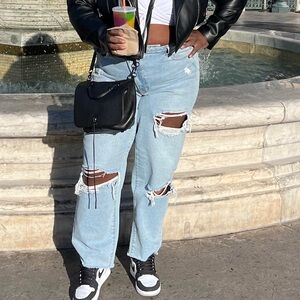 Fashion to Figure Distressed Light Blue Jeans w/Assymetrical zipper. Size 16